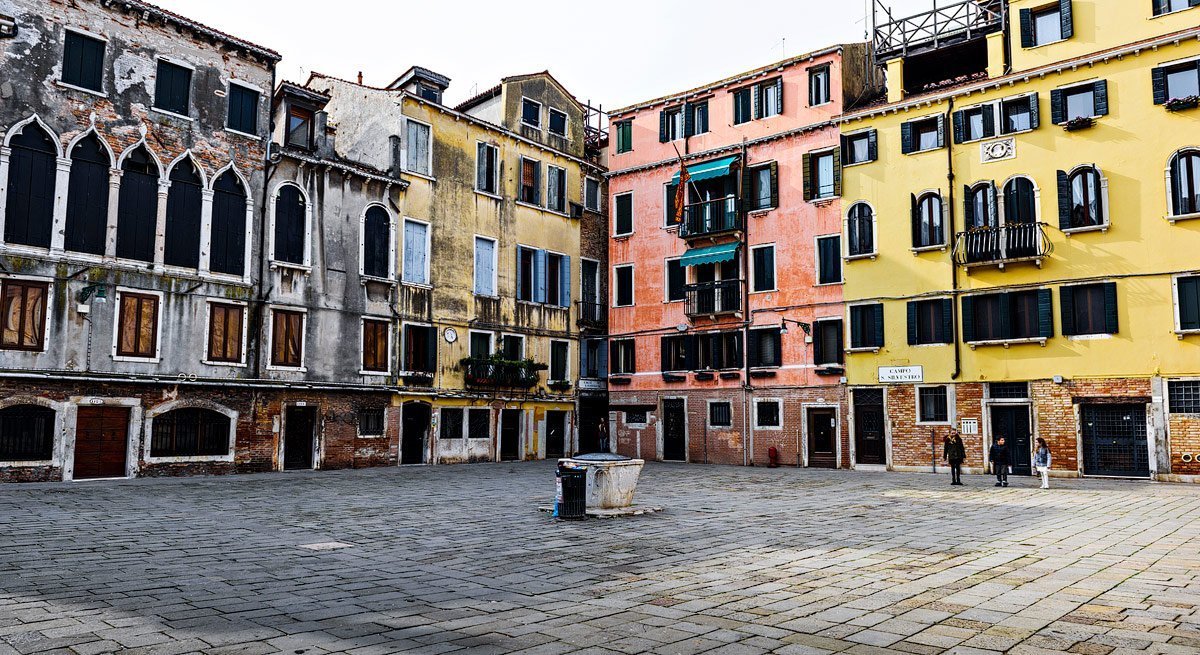 piazza with colorful houses by travel photographer
