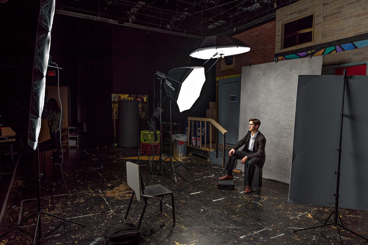 McKinney High school seniors pose for portraits in the black box theater practice room behind the scenes
