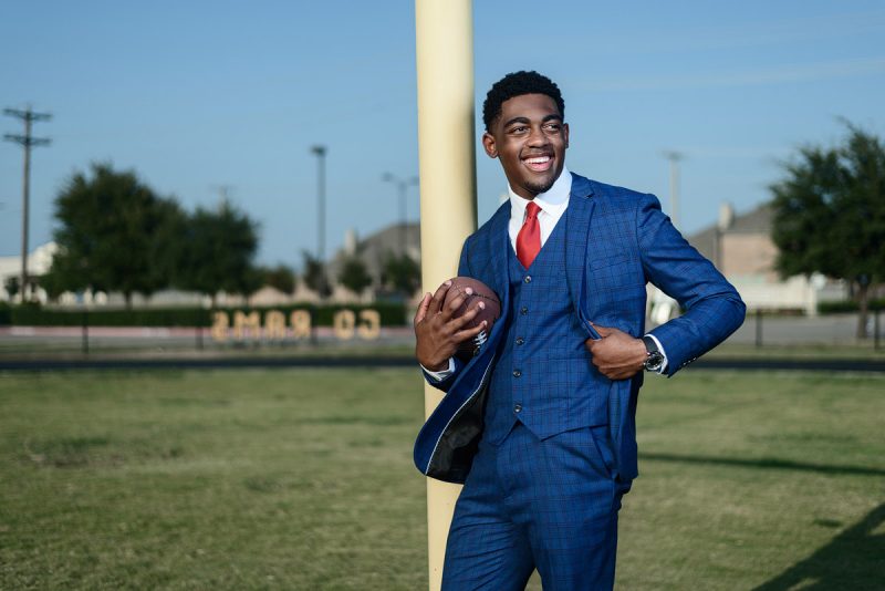 senior pictures in mckinney texas by jeff dietz photography of McKinney north football player in suit