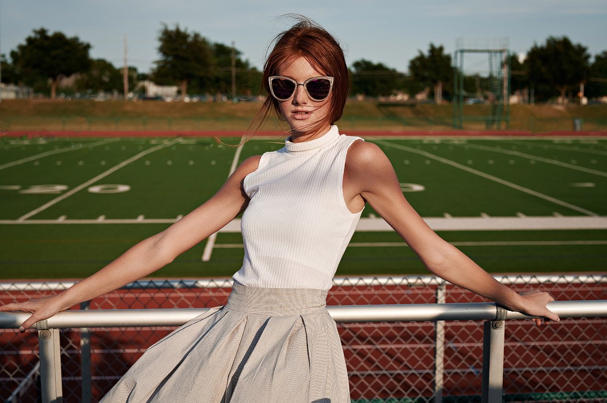 dallas high school cheerleader wearing sunglasses for senior portraits