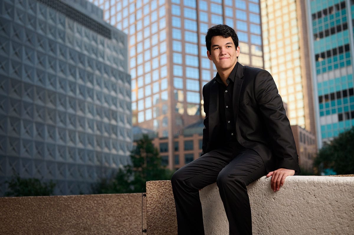 Jesuit Senior Pictures Downtown Dallas Boy Sitting On Wall